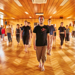 Shinichi and participants standing.